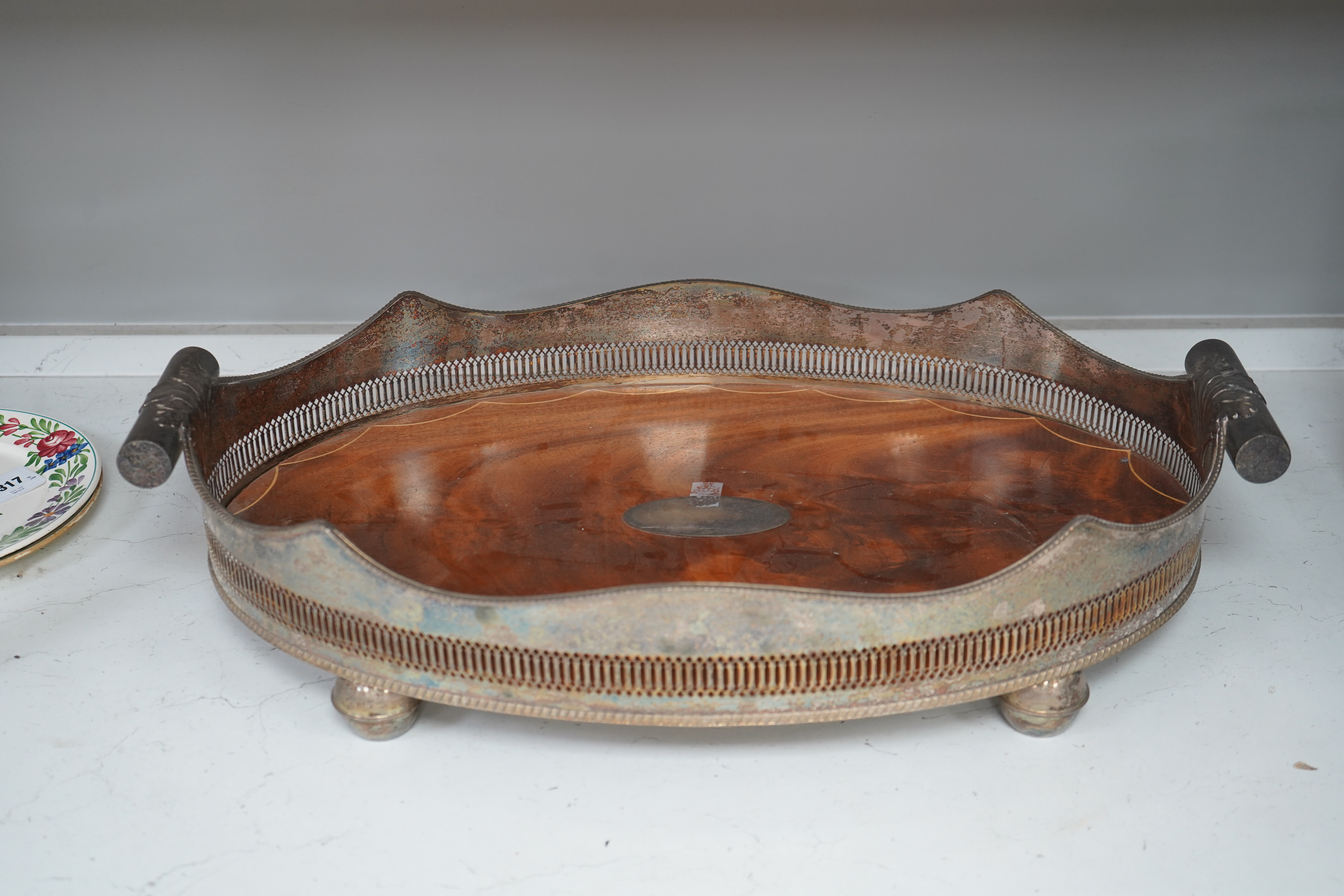 An early 20th century electroplate galleried mahogany tray, 66cm wide. Condition - fair